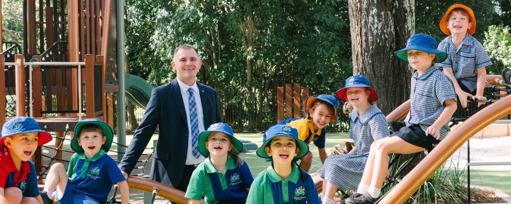Principal with Students on Playground